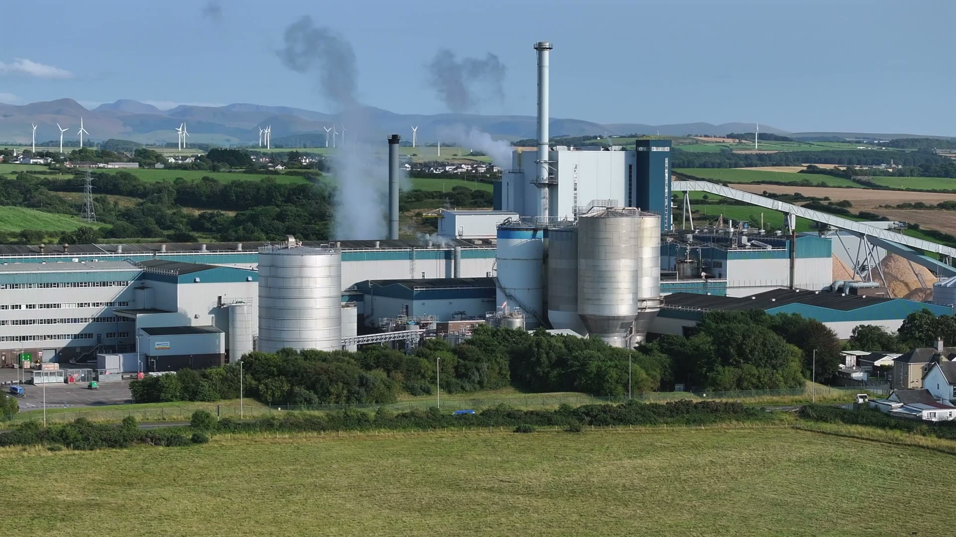 Wind farm turbines in open landscape